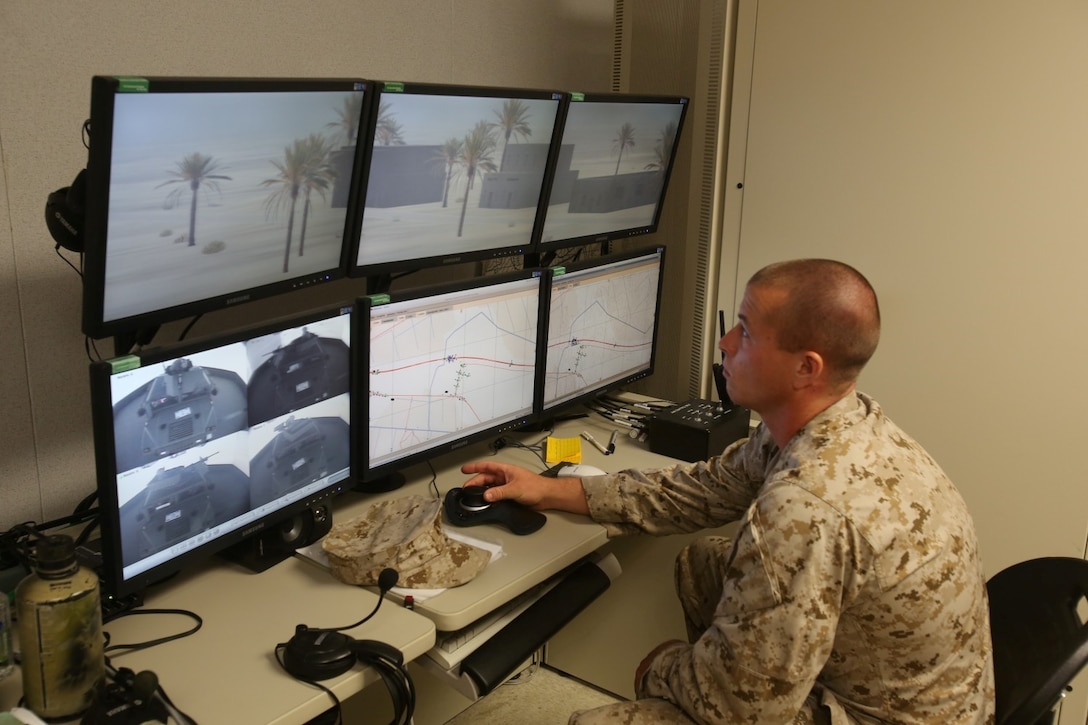 MARINE CORPS BASE CAMP PENDLETON, Calif. – Corporal Seth Baker, range operator, Combat Convoy Simulator and native of Canaseraga, N.Y., monitors Marines serving with 1st and 2nd Combined Anti-Armor Teams, 2nd Battalion, 5th Marine Regiment, as they conduct a simulated convoy in the CCS here, July 25, 2013. The CCS provides an immersive training environment for both convoy operations training and command and control procedures for vehicle and convoy commanders in tactical scenarios. The CCS places Marines in a realistic environment and allows for repetition, review and critique while saving time, maintenance, ammunition, weapons and range facilities.