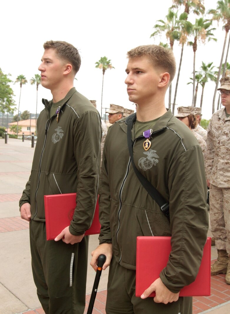 NAVAL MEDICAL CENTER SAN DIEGO, Calif. – Corporal Matthew S. Babler, left, and Lance Cpl. Justin R. Beer, riflemen temporarily assigned to Wounded Warrior Battalion West, were presented the Purple Heart for sustaining injuries from sniper fire while deployed with 3rd Battalion, 4th Marine Regiment, to Musa Qal’ah district, Helmand province, Afghanistan, in support of Operation Enduring Freedom. Major Gen. Lawrence D. Nicholson, 1st Marine Division commanding general, and a native of Toronto, Canada, presented the medals to Babler, a native of Monticello, Wisc., and Beer, a native of Bushnell, Ill., during an award ceremony here, July 31, 2013.
(U.S. Marine Corps photo by Sgt. Jacob H. Harrer)