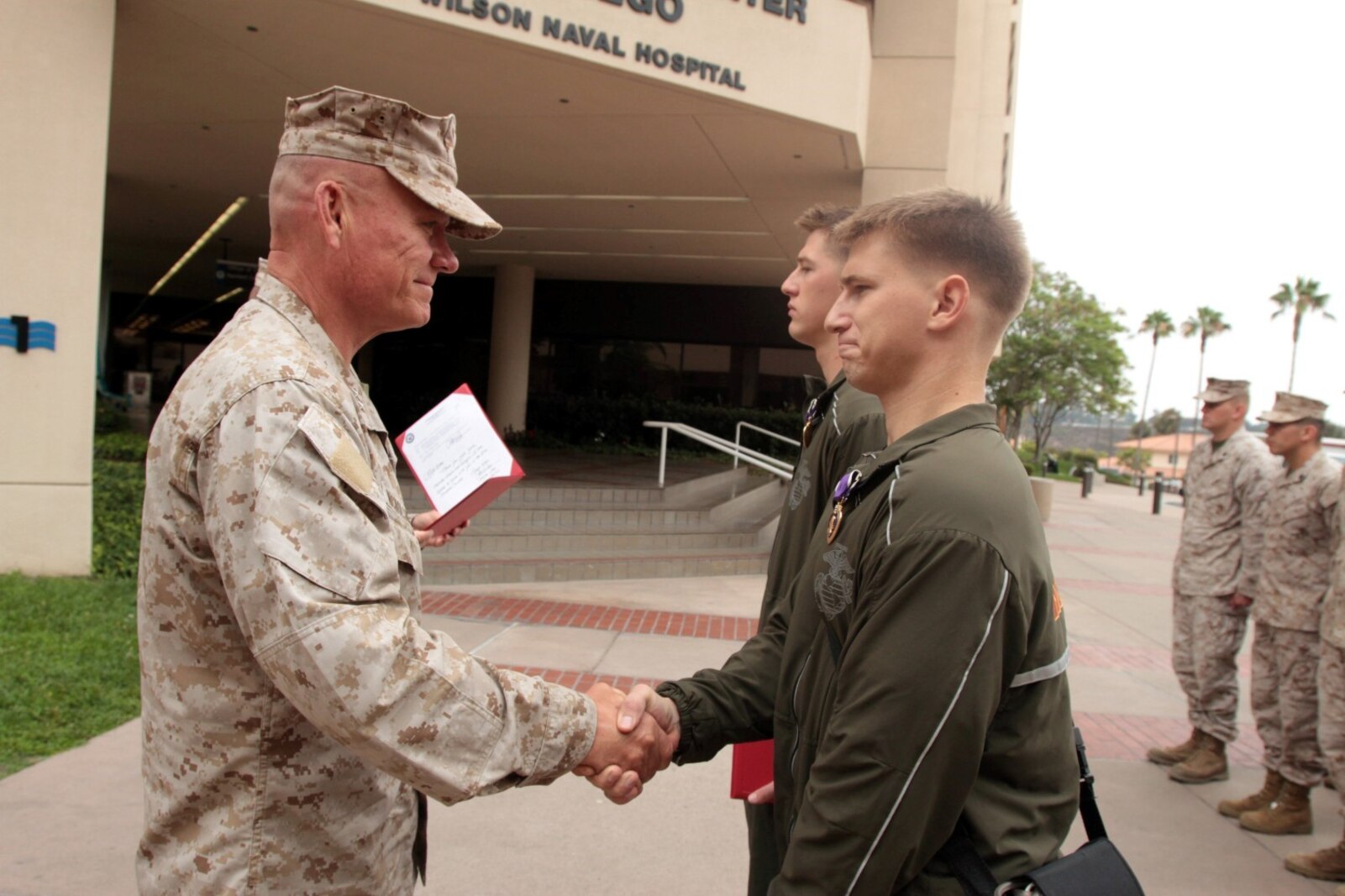 NAVAL MEDICAL CENTER SAN DIEGO, Calif. – Major Gen. Lawrence D. Nicholson, 1st Marine Division commanding general, congratulates Lance Cpl. Justin R. Beer, a rifleman temporarily assigned to Wounded Warrior Battalion West, after presenting the Purple Heart during an award ceremony here, July 31, 2013. Beer, a native of Bushnell, Ill., was wounded by enemy sniper fire, May 27, 2013, while deployed with 3rd Battalion, 4th Marine Regiment, to Musa Qal’ah district, Helmand province, Afghanistan, in support of Operation Enduring Freedom. Beer is a 2010 graduate of Bushnell-Prairie City High School.
(U.S. Marine Corps photo by Sgt. Jacob H. Harrer)