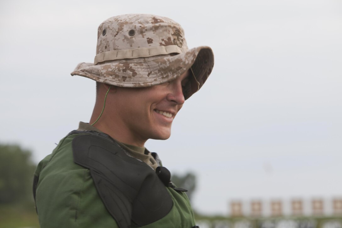 Lance Cpl. Shane O’Flynn, a member of the Marine Forces Reserve Marksmanship Training Unit, Marine Corps Reserve Rifle Team, based out of Marine Corps Base Quantico, Va., smiles about a shot "in the black" on the 300-yard line during the National Trophy Individual Match at Camp Perry, Ohio, July 30. The rifle match is part of the annual Civilian Marksmanship Program's National Matches, which have been taking place annually since 1903. (U.S. Marine Corps photo by Cpl. Jessica Ito)