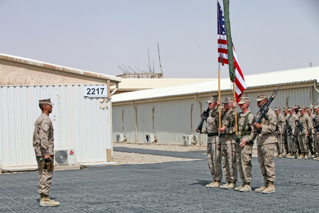 Marines with Regimental Combat Team 7 stand at attention after the unit flag was encased during a ceremony here, July 31, 2013. Afghan National Security Forces have taken control of combat operations throughout Helmand, which has eliminated the need for a Marine infantry regimental headquarters. RCT-7 has now officially turned over its responsibilities to Regional Command (Southwest).