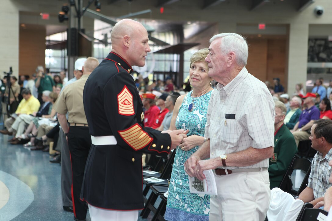 Sgt. Maj. Micheal P. Barrett, the 17th Sergeant Major of the Mrine Corps, speaks to Mrs. Ellyn Dunford and Mr. Joseph F. Dunford Sr. at the monument dedication for Staff Sgt. Reckless,a warhorse that fought alongside the Marines during the Korean War. The monument was unveiled in the Semper Fidelis Memorial Park at the National Museum of the Marine Corps on July 26, 2013. (U.S. Marine Corps photo by Sgt. Marionne T. Mangrum)