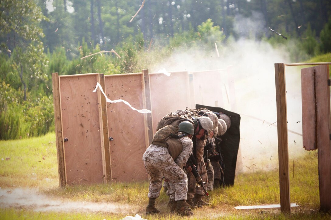 Marines with 2nd and 4th Combat Engineer Battalions and 8th Engineer Support Bn. ignite a breaching charge here, July 24. The urban demolition range was part of the Sapper Leaders Course, first of its kind designed to allow Reserve and active-duty Marines to receive advanced training in combat engineering.