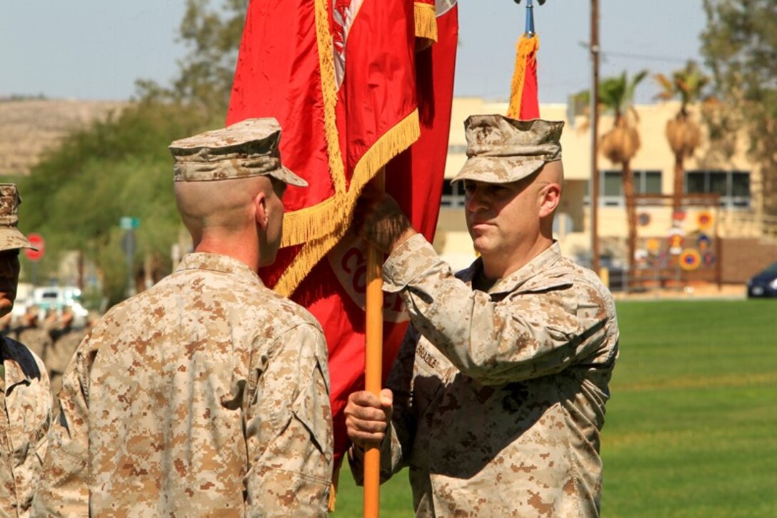 Col. Gregory T. Breazile relinquishes command of the Marine Corps Communication-Electronics School, July 23.