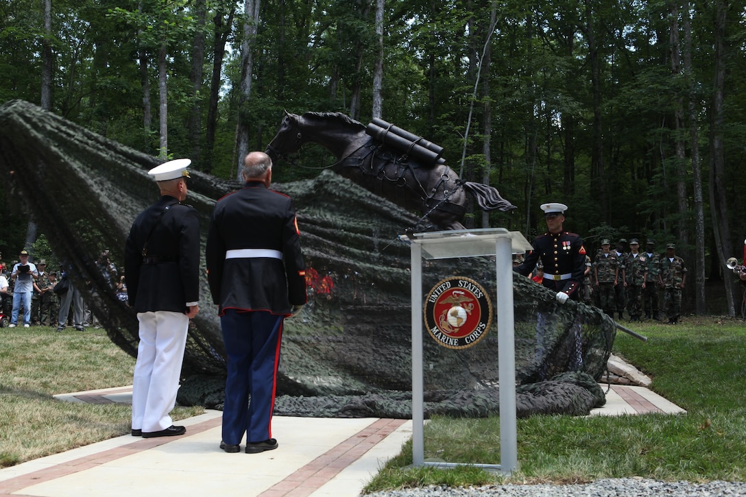 Gen. James F. Amos, the 35th Commandant of the Marine Corps, and Sgt. Harold Wadley, a Korean War veteran, look on as Marines unveil the Staff Sgt. Reckless monument in the Semper Fidelis Memorial Park at the National Museum of the Marine Corps on July 26, 2013. (U.S. Marine Corps photo by Sgt. Marionne T. Mangrum)