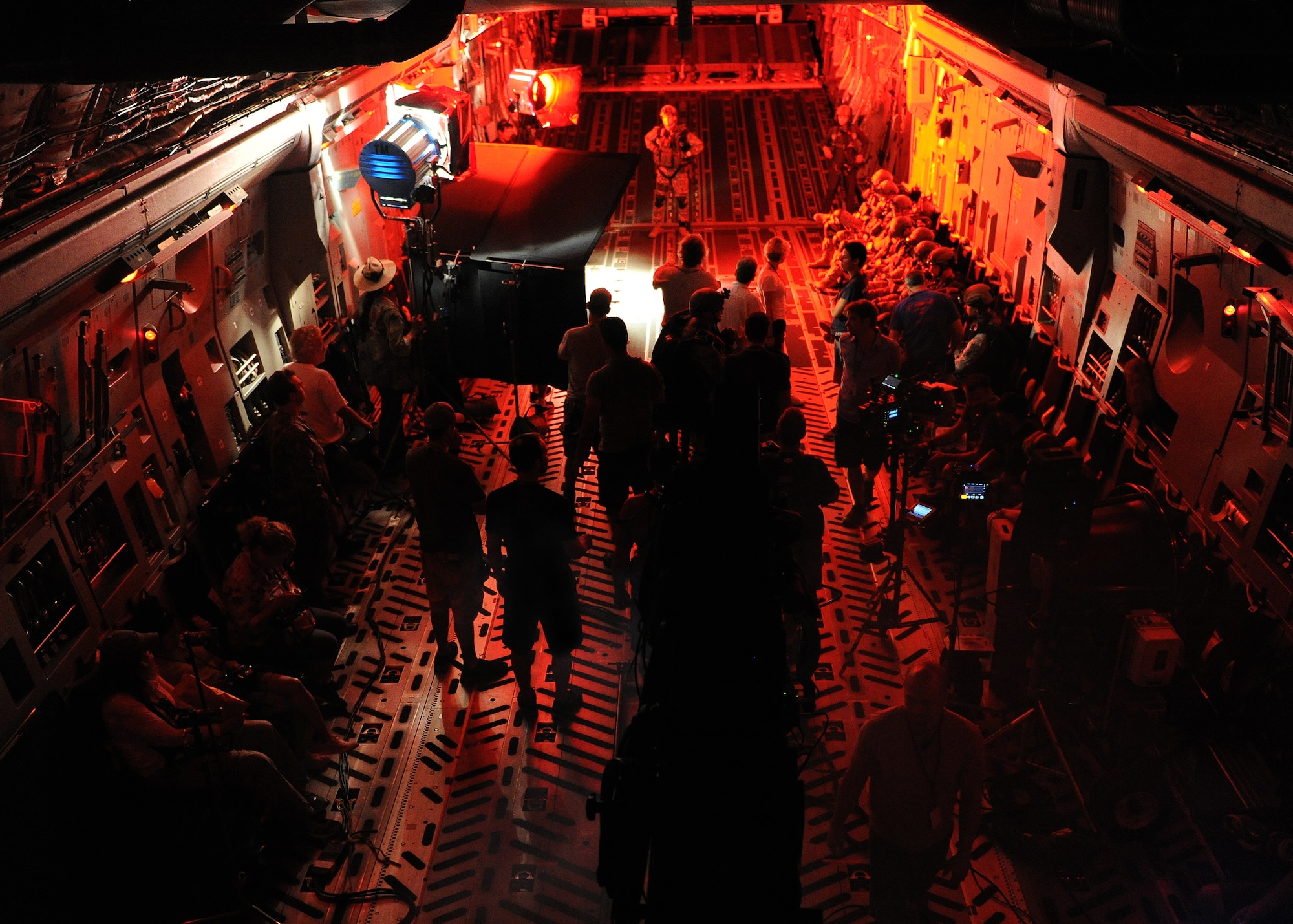 A camera crew from a major motion picture prepares to film a scene aboard a C-17 Globemaster III at Joint Base Pearl Harbor-Hickam, July 1, 2013. Production of the scenes involved 365 people, 300 crew, and 65 Department of Defense members. (U.S. Air Force photo/Tech. Sgt. Jerome S. Tayborn)