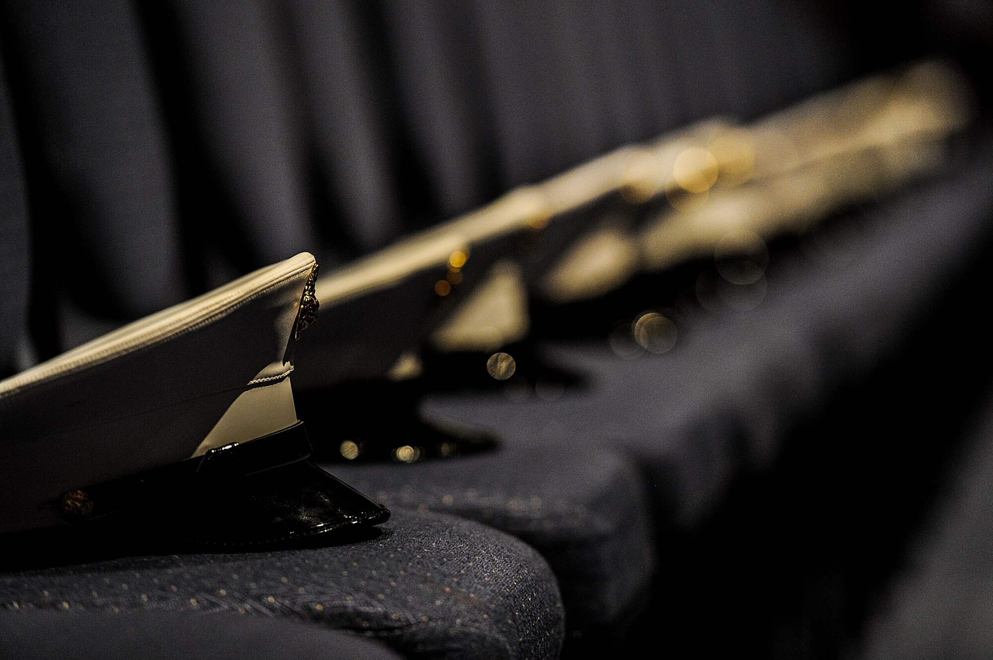 A row of Marine hats sit on chairs during a memorial service for retired U.S. Air Force Col. George “Bud” Day at the Emerald Coast Convention Center on Okaloosa Island, Fla., Aug. 1. Day, a Medal of Honor recipient and combat pilot with service in World War II, Korea and Vietnam, passed away July 28 at the age of 88. (U.S. Air Force Photo / Airman 1st Class Christopher Callaway)