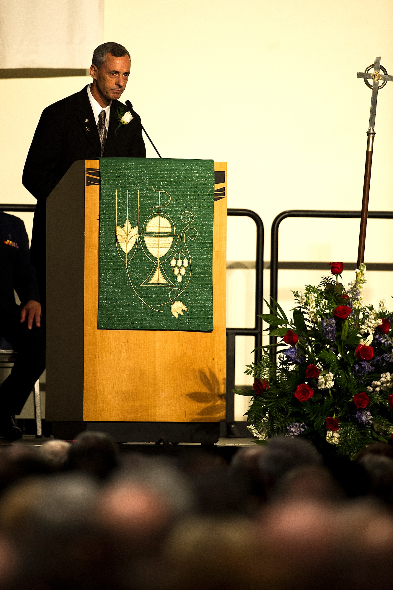George Day Jr., son of U.S. Air Force Col. George “Bud” Day speaks to the crowd during a memorial service for Day at the Emerald Coast Convention Center on Okaloosa Island, Fla., Aug. 1. Day, a Medal of Honor recipient and combat pilot with service in World War II, Korea and Vietnam, passed away July 28 at the age of 88. (U.S. Air Force Photo / Airman 1st Class Christopher Callaway)
