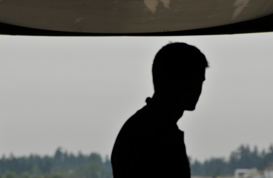 Tech. Sgt. Chris Kelley, a 97th Airlift Squadron loadmaster, out McChord Field, Wash., finishes lowering the ramp of a C-17 Globemaster III, July 13, 2013. Kelley assisted  in providing C-17 expertise for a tour group of community leaders hosted by the Western Air Defense Sector leadership. (U.S. Air Force Reserve photo/Master Sgt. Jake Chappelle)