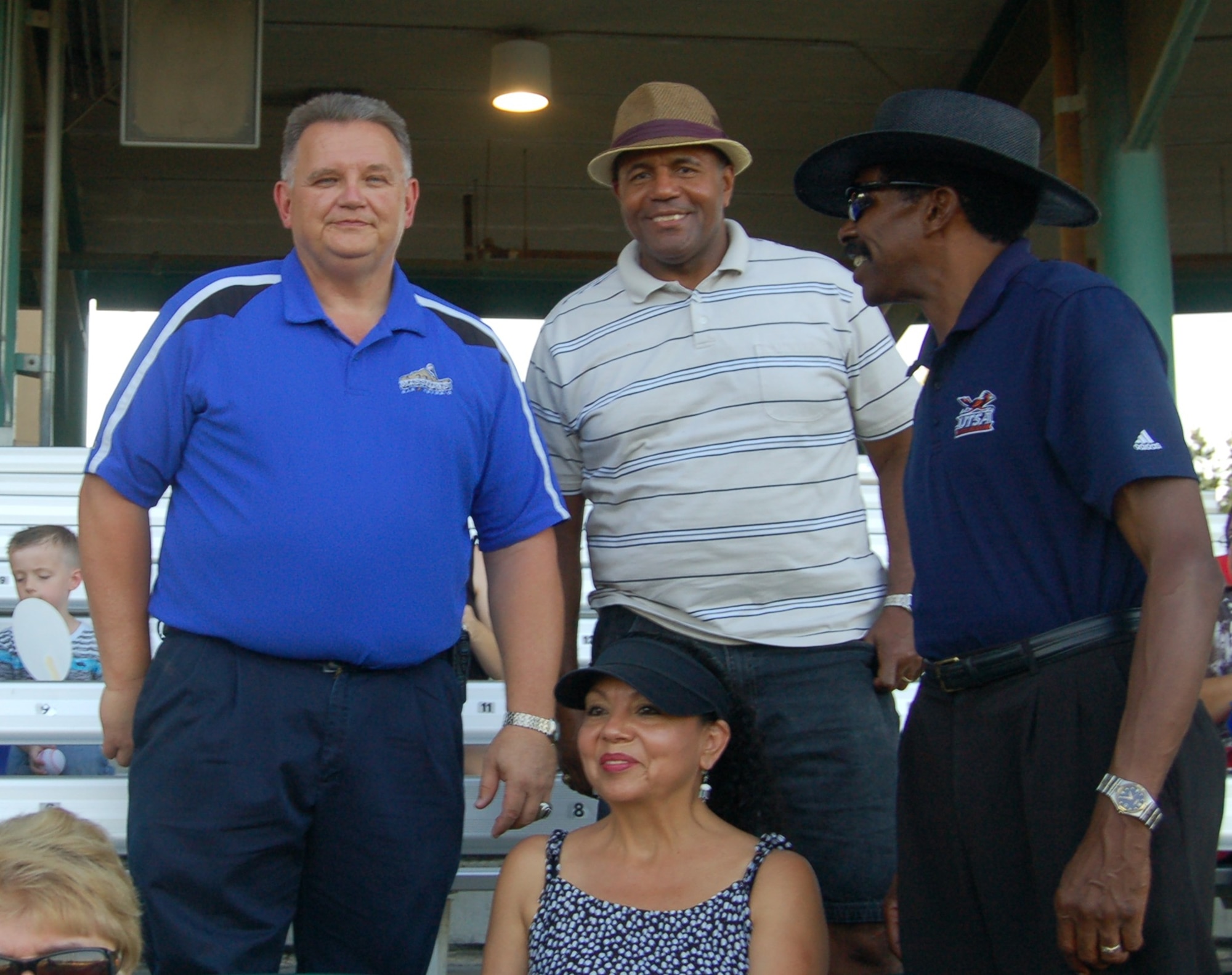Bill Gerlt, San Antonio Missions assistant general manager and 433rd Airlift Control Flight Honorary Commander, Odis Blueitt, 433rd Aeromedical Staging Squadron HCC; and Otis Scott, 433rd Aircraft Maintenance Squadron HCC with his spouse, Rose Scott attend a San Antonio Missions baseball game  at Nelson Wolff Municipal Stadium July 31. (U.S. Air Force/Elsa Martinez)