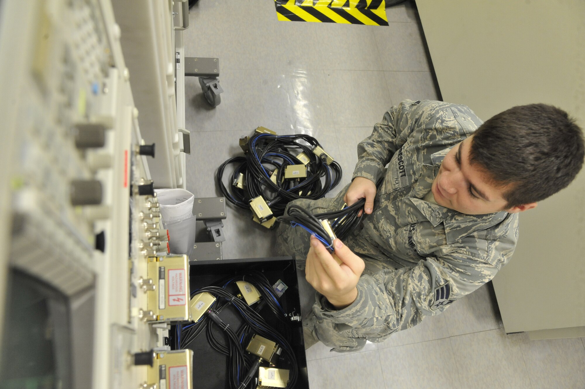 Senior Airman Christopher Prescott, 509th Maintenance Squadron avionics back shop team member, verifies inventory on portable calibration equipment at Whiteman Air Force Base, Mo., July 25, 2013. The avionics team performs semi-annual inspections to ensure no equipment is missing or damaged, and they recalibrate equipment every 180 days to verify the test station’s serviceability. (U.S. Air Force photo by Airman 1st Class Keenan Berry/Released)