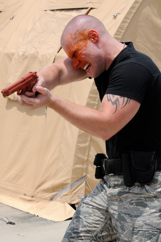 Airman 1st Class Christopher Kleist, 188th Security Forces Squadron, participates in Oleoresin Capsicum Spray training at Ebbing Air National Guard Base, Fort Smith, Ark. July 13, 2013. Before SFS Airmen can use the spray on the job, they must undergo the training to understand its effects. (U.S. Air National Guard photo by 1st Lt Holli Snyder/188th Fighter Wing Public Affairs)