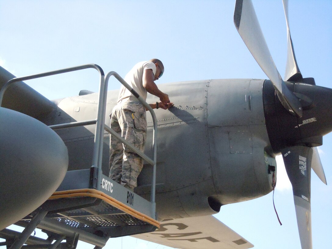 A Kentucky Air National Guard member works on a C-130 Hercules engine at the Air National Guard Combat Readiness Training Center in Gulfport, Miss., on June 18, 2013, as part of a week-long course called Maintenance University. The course was created by the Kentucky Air National Guard's 123rd Maintenance Group. (U.S. Air National Guard photo by Col. Ken Dale)