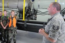 YOUNGSTOWN AIR RESERVE STATION, Ohio--Air Force ReserveTechnical Sgt. Mike Lamantia explains the C-130 Modular Aerial Spay System (MASS) to a group of Civil Air Patrol cadets here, July 31, 2013. The Civil Air Patrol toured the base on Wednesday, visiting the aerial spray shop as well as avionics, propulsion and the Navy and Marine Corps Reserve Center. Lamantia is a 910th Aerial Spray Maintenance Technician here. YARS is home to the Department of Defense’s only large-area fixed-wing aerial spray capability. (U.S. Air Force photo by Technical Sergeant James Brock) 