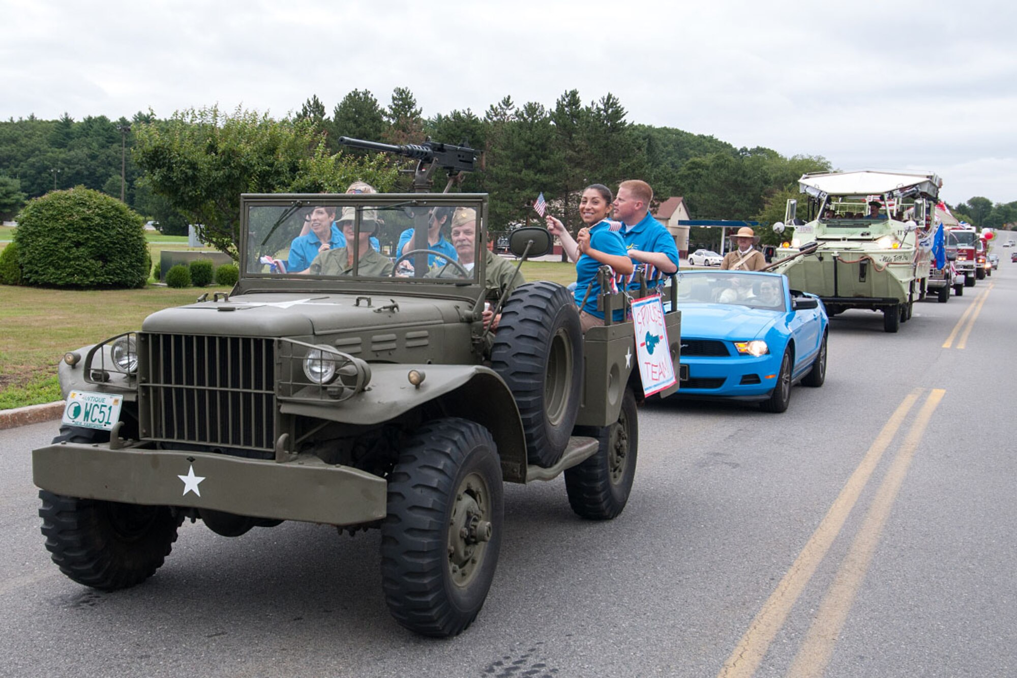 HANSCOM AIR FORCE BASE, Mass. – Airmen are recognized during a Heroes Homecoming parade down Barksdale Street July 25 as base personnel lined the streets to wave American flags and show their appreciation to recent deployers. The parade was followed by a picnic in Memorial Park that recognized deployers and their families for outstanding service and commitment. (U.S. Air Force photo by Rick Berry)