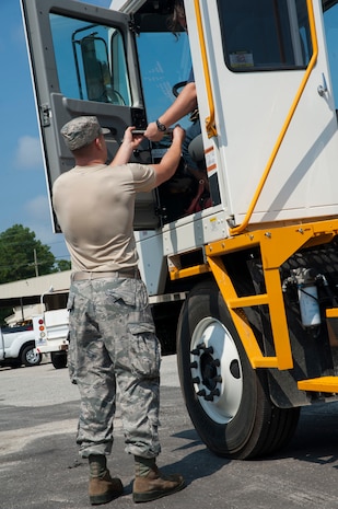 Senior Airman Mark Roth, 628th Logistics Readiness Squadron Petroleum Oil and Lubricants fuels specialist, gets a customer’s signature July 25, 2013, at Joint Base Charleston- Weapons Station, S.C. In one month, the 628th LRS POL fuels provided more than 1,600 gallons of gas to 80 vehicles on the Weapons Station. The 628th LRS has been providing this service since October 2010. A new service station is under construction at the Weapons Station and is scheduled to open later this year.  (U.S. Air Force photo/Senior Airman Ashlee Galloway)

