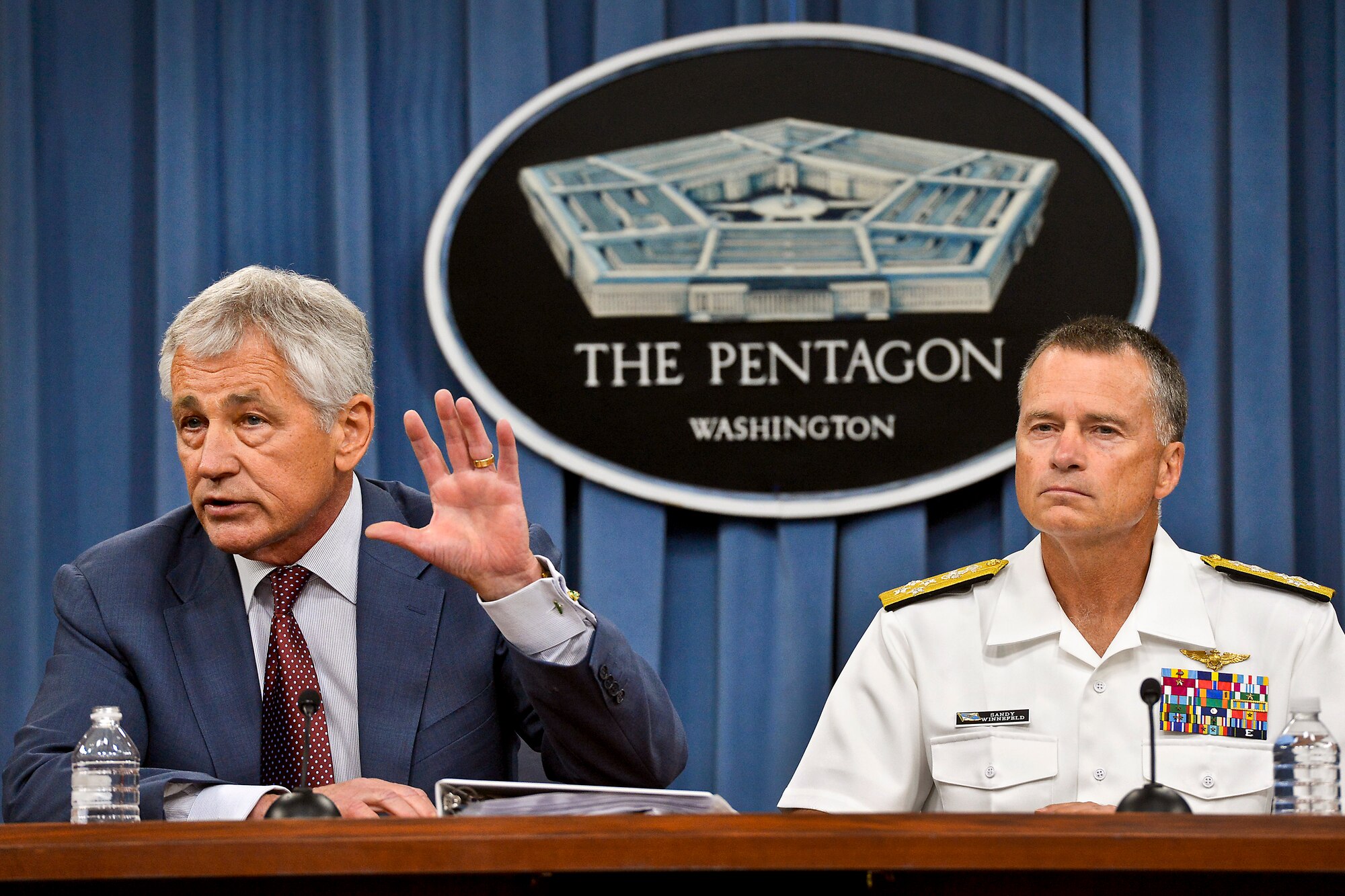 Defense Secretary Chuck Hagel answers a question on the Strategic Choices Management Review during a news conference at the Pentagon, July 31, 2013. Navy Adm. James A. Winnefeld Jr., right, vice chairman of the Joint Chiefs of Staff, joined Hagel for the briefing. (DOD photo by Glenn Fawcett)