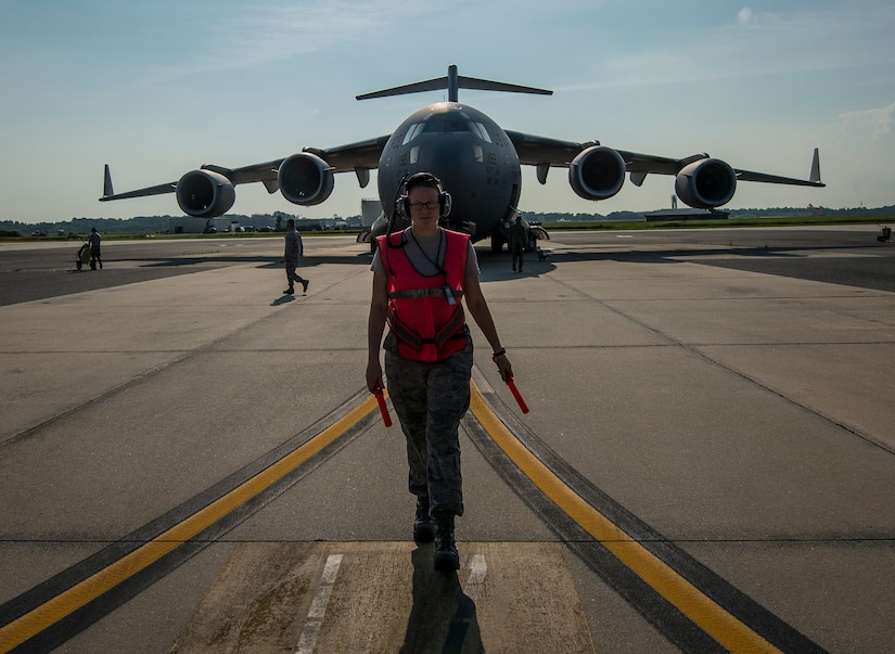 Senior Airman Brandi Barentine, 437th Aircraft Maintenance Squadron crew chief, walks to her designated area to begin marshaling a C-17 Globemaster III July, 30, 2013, at Joint Base Charleston – Air Base, S.C. (U.S. Air Force photo/ Senior Airman Dennis Sloan)