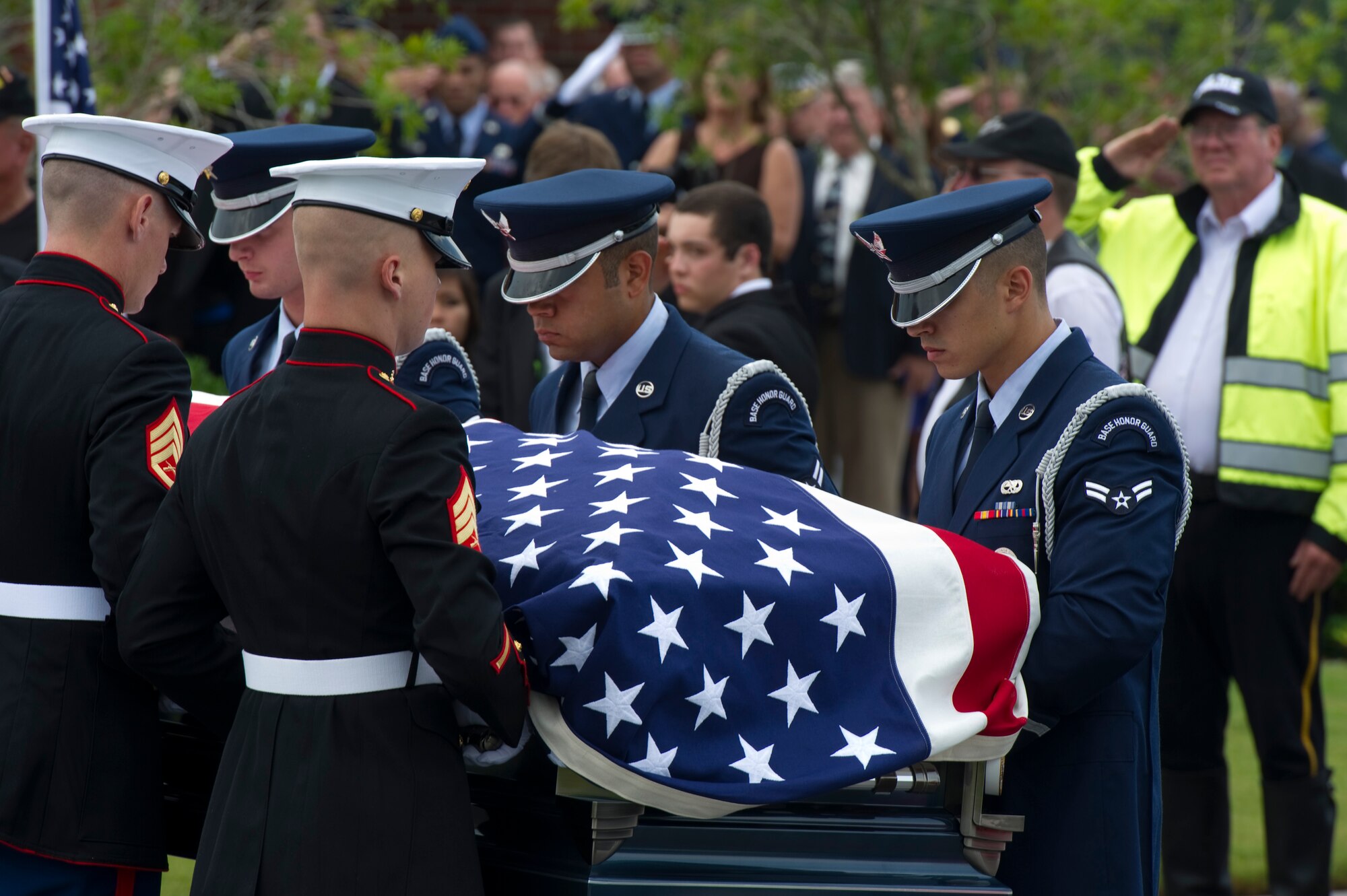 Pallbearers, made up of Airmen and Marines, carry the casket of retired U.S. Air Force Col. George “Bud” Day during his funeral service at Barrancas National Cemetery on Naval Air Station Pensacola, Fla., Aug. 1, 2013. Day, a Medal of Honor recipient and combat pilot with service in World War II, Korea and Vietnam, passed away July 28 at the age of 88. (U.S. Air Force Photo/Staff Sgt. John Bainter))