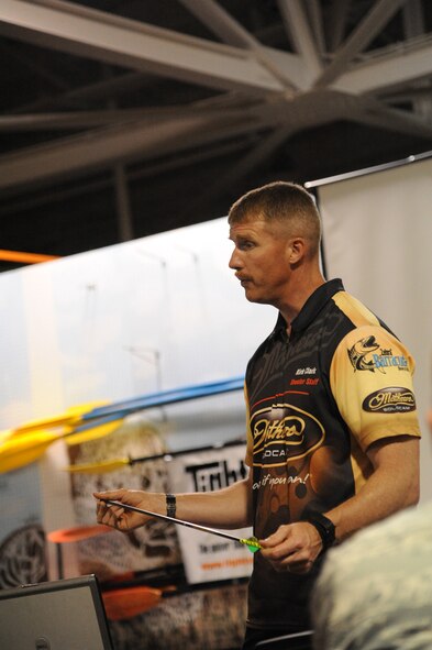 Kirk Clark, 341st Medical Operations Squadron exercise physiologist, shows attendees of his seminar different types of arrows and the pros and cons associated with each one.  During his seminars various styles of bows and arrows are looked at in detail to help newcomers to the sport make an informed decision on what products to buy while preparing for a hunt. (U.S. Air Force photo/Airman 1st Class Collin Schmidt)