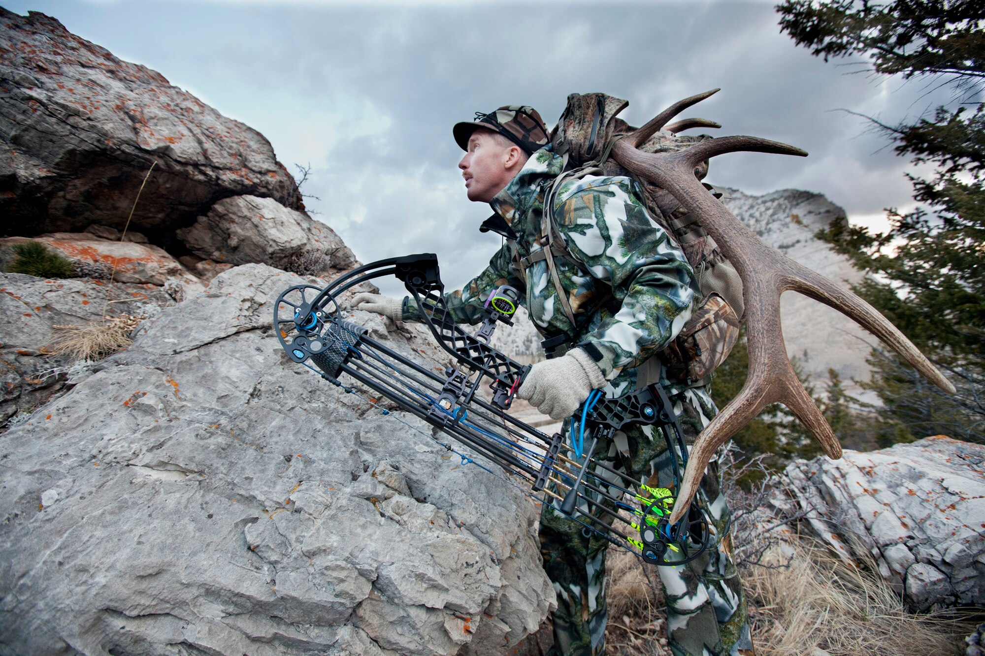 Kirk Clark, 341st Medical Operations Squadron exercise physiologist, walks in the backwoods of Montana during a hunt. The antlers he carries with him are used to lure game in close during a hunt. (Courtesy photo)