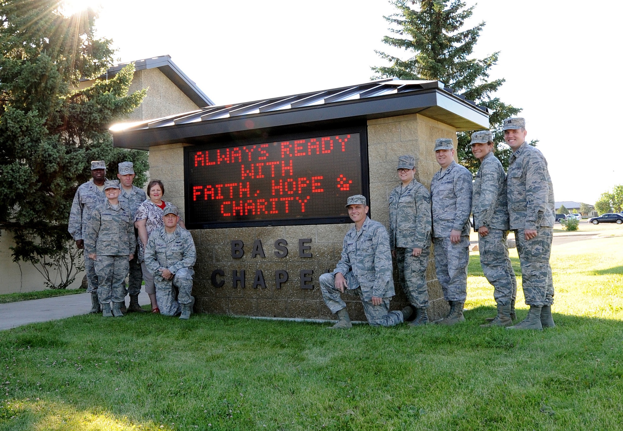 The Malmstrom Air Force Base Chapel staff pose for a group photo outside the chapel. The chapel currently employs seven chaplains who represent the Protestant and Catholic faith groups. The chaplains are supported by four chaplain’s assistants, as well as a chapel secretary. Five contractors act as program coordinators supporting many of the other chapel functions. (U.S. Air Force photo/Staff Sgt. R.J. Biermann)