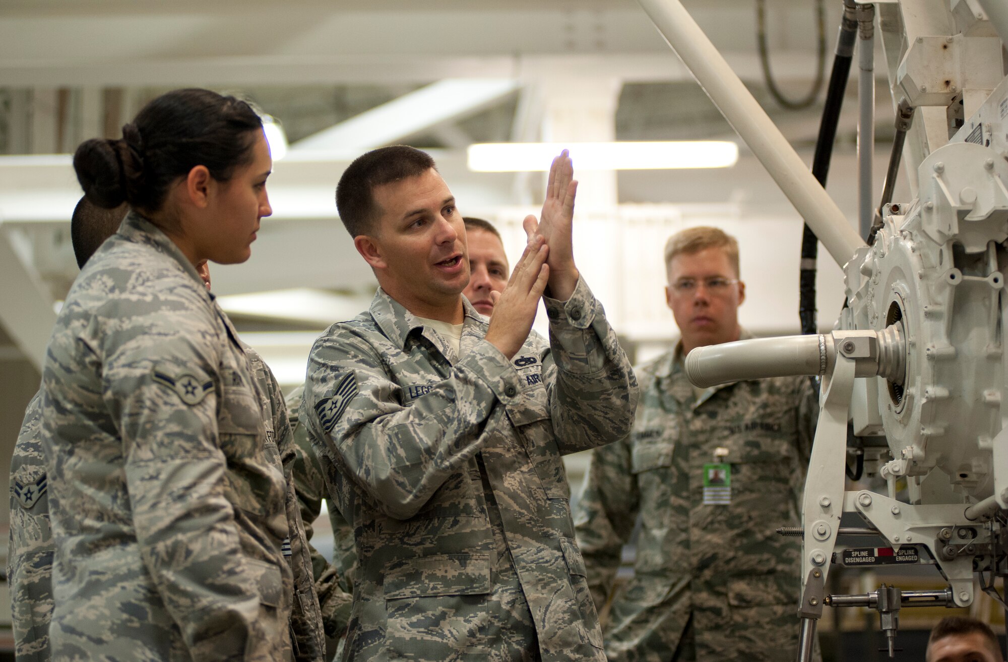 Tech. Sgt. Robert Legg instructs his class August 1 on how to safely handle missile systems. He also conducts hands-on training with the students.  (U.S. Air Force photo by Airman 1st Class Jelani Gibson) 