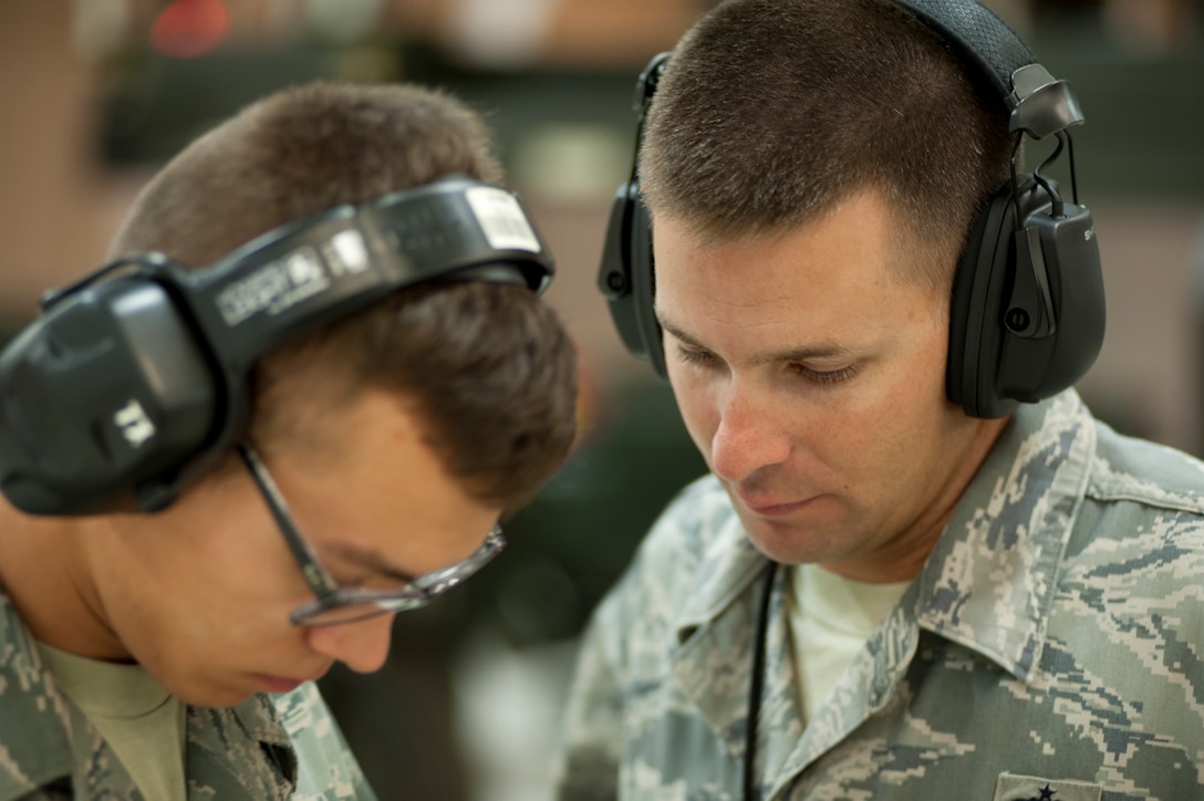 Tech. Sgt. Robert Legg instructs his class August 1 on how to safely handle missile systems. He also conducts hands-on training with the students.  (U.S. Air Force photo by Airman 1st Class Jelani Gibson) 