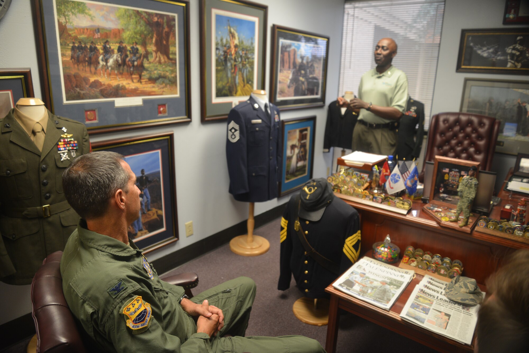 Retired Command Sgt. Maj. Terry L. Braddock, director of sales/Base Supply Center and Military Liaison, briefs Col. Jeffrey Pennington, 433rd Airlift Wing commander, Joint Base San Antonio – Lackland, just prior to a guided tour of the SALB headquarters. Members of the 433rd AW were given a tour of their facilities July 22. (U.S. Air Force photo by Senior Master Sgt. Minnie Jones)