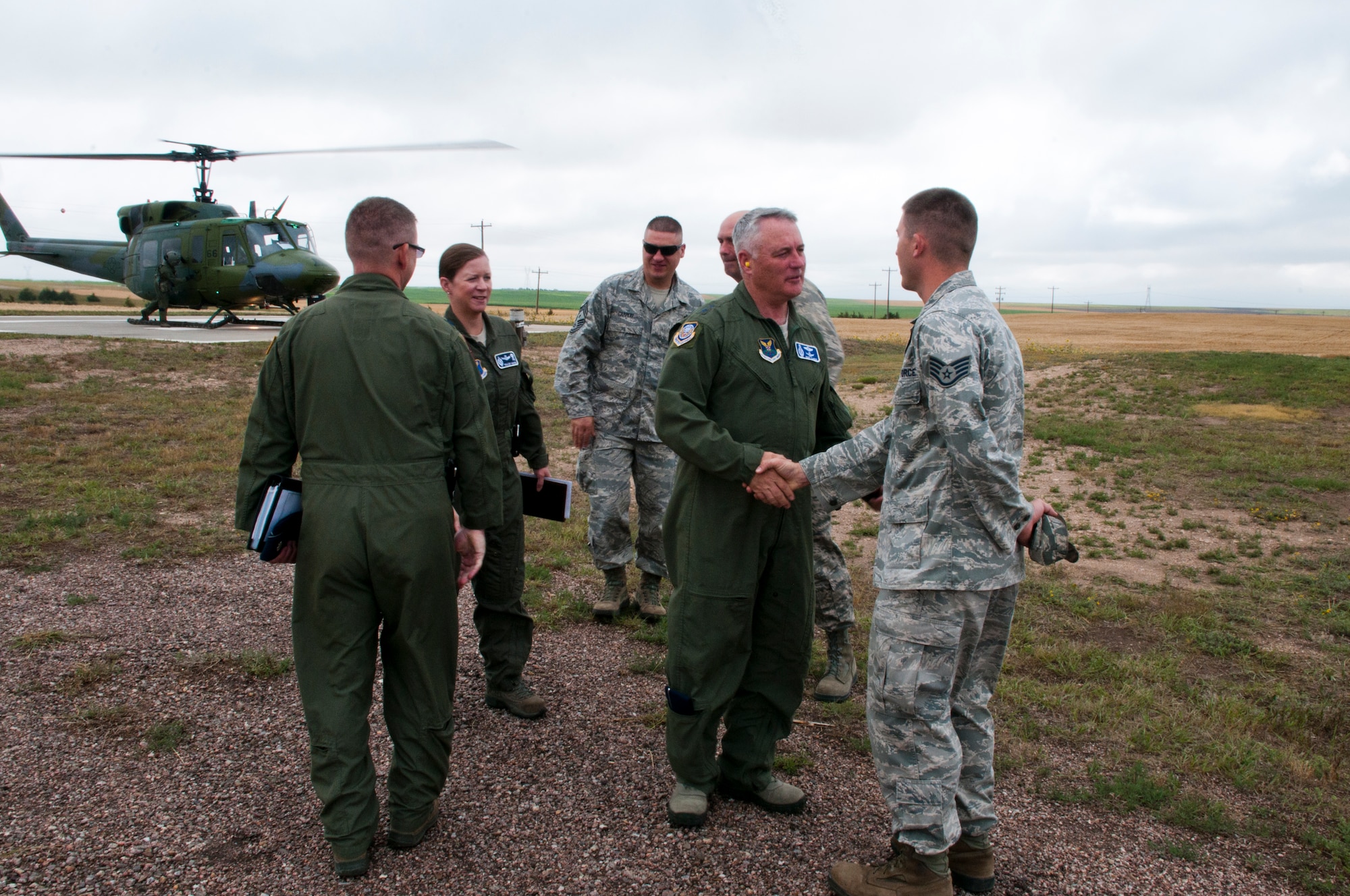Maj. Gen. Michael Carey, 20th Air Force commander, arrives to at the Foxtrot-01 Missile Alert Facility and is greeted by Staff Sgt. Benjamin Cestoni, 320th Missile Squadron facility manager July 29, 2013. (U.S. Air Force photo by Airman 1st Class Jason Wiese)