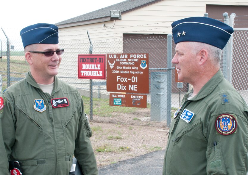 Lieutenant Col. Bob Ewers, 320th Missile Squadron commander, welcomes Maj. Gen. Michael Carey, 20th Air Force commander, to the Foxtrot-01 Missile Alert Facility July 29, 2013. (U.S. Air Force photo by Airman 1st Class Jason Wiese)