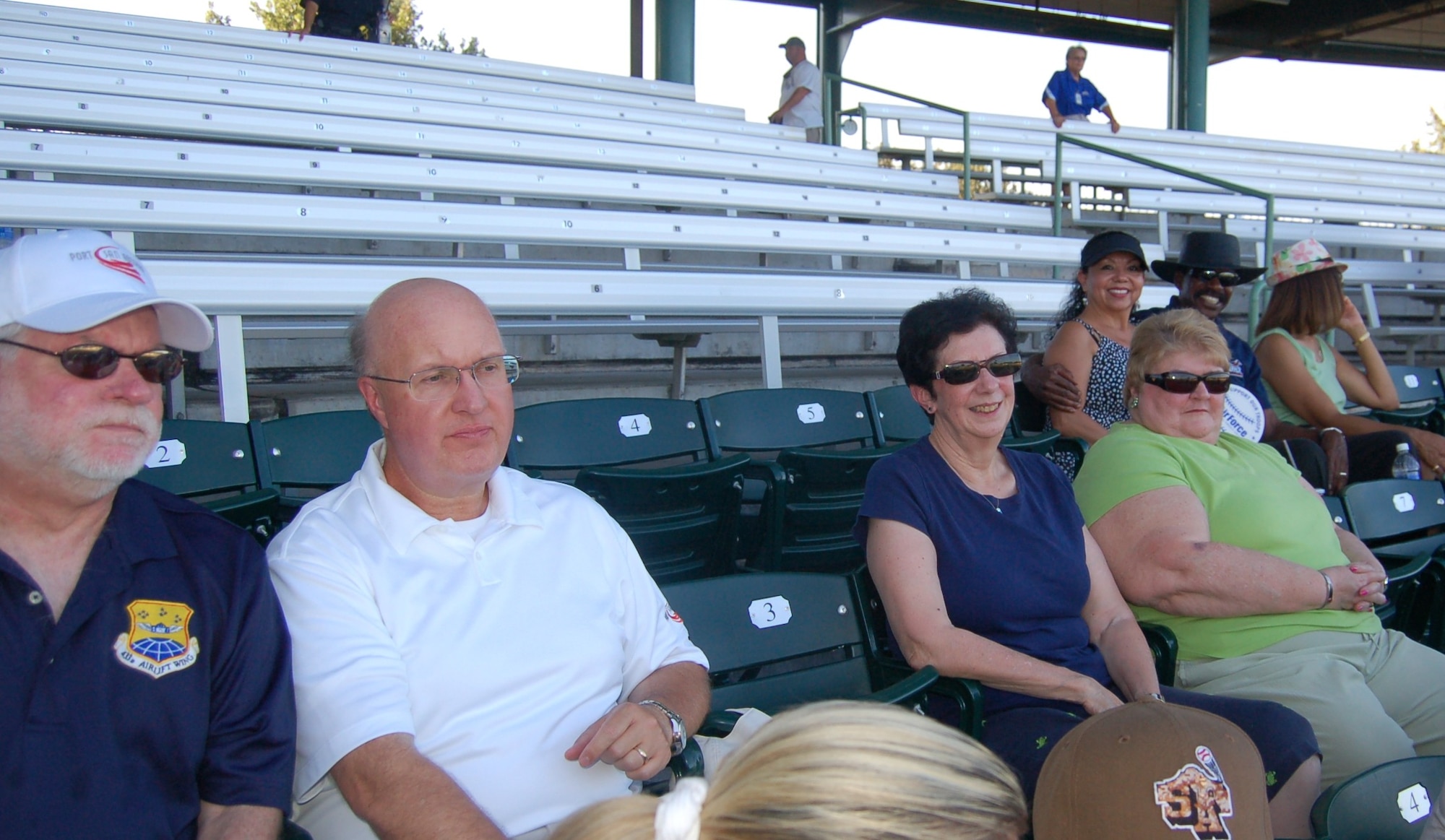 433rd Airlift Wing Honorary Commanders attended a San Antonio Missions baseball game against the Corpus Christi Hooks July 31 at Nelson Wolff Municipal Stadium.  Seated from far left is Mark Frye, 733rd Training Squadron Honorary Commander, with his guest; Regina Aune, 433rd Aeromedical Evacuation Squadron HCC, with her guest; and Otis Scott (far right), 433rd Aircraft Maintenance Squadron HCC, seated and guest. (U.S. Air Force Photo/Elsa Martinez)