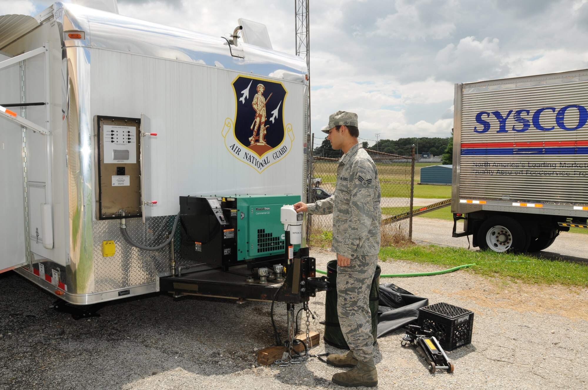 U.S. Air Force Senior Airman Christian King, Force Support Flight, 123d Airlift Wing, Louisville, Kentucky, checks the level of a Disaster Response Mobile Kitchen Trailer (DRMKT) July 15 at ‘Hope of Martin’ Innovative Readiness Training held at Martin Middle School in Martin, Tenn. (U.S. Air National Guard photo by Master Sgt. Carlos J. Claudio/Released).
