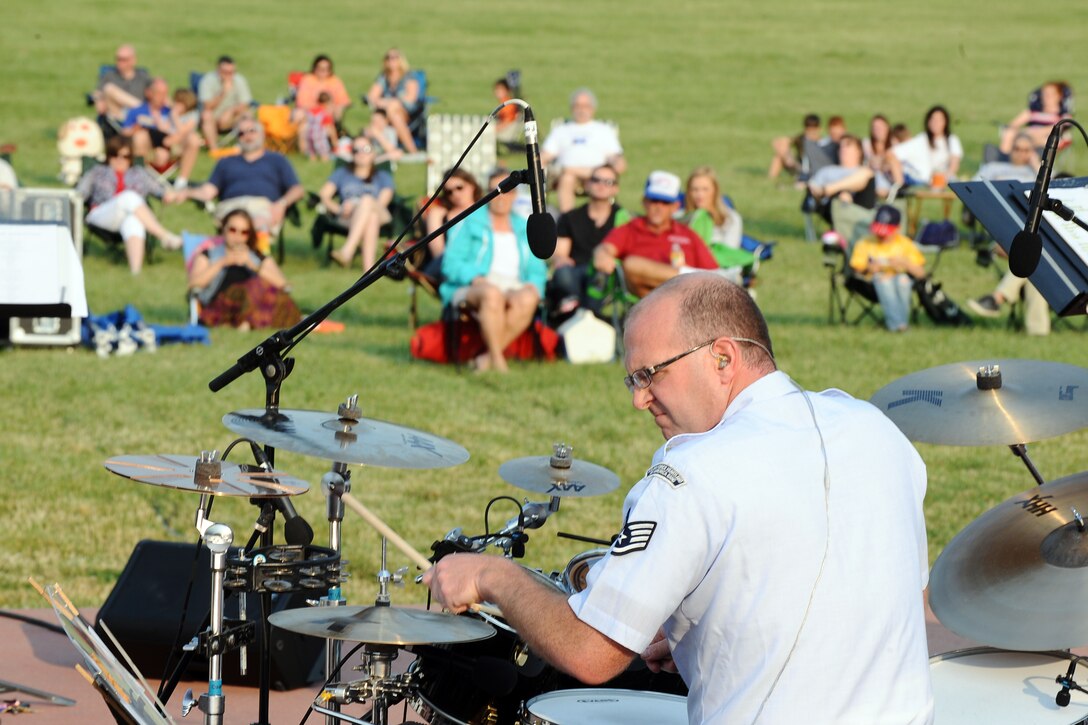 Staff Sergeant Jarrett Robinett performs with Raptor for the community at the Offutt Air Force Base Parade Ground for the Heartland of America Band's "Sundays on Parade" concert series