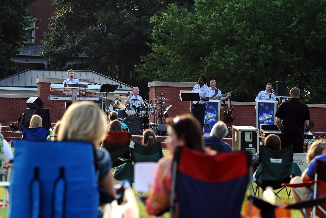 Members of the local community enjoy Raptor's performance at the Offutt Air Force Base Parade Ground for the Heartland of America Band's "Sundays on Parade" concert series