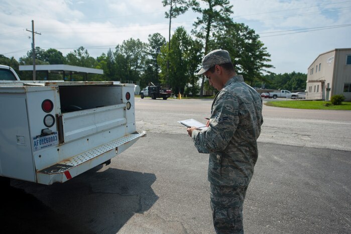 Airman 1st Class Christopher Castro, 628th Logistics Readiness Squadron Petroleum Oil and Lubricants fuels specialist, records vehicle information before servicing a vehicle July 25, 2013, at Joint Base Charleston- Weapons Station, S.C. In one month, the 628th LRS POL provided more than1,600 gallons of gas to 80 vehicles on the Weapons Station. POL fuels supplies JB Charleston vehicles with fuel, including rail operations, cranes on Wharf Alpha to offload ships, port operations on the water, the 628th Security Forces Squadron and the U.S. Coast Guard. The 628th LRS has been providing this service since October 2010. A new service station is under construction at the Weapons Station and is scheduled to open later this year. (U.S. Air Force photo/Senior Airman Ashlee Galloway)