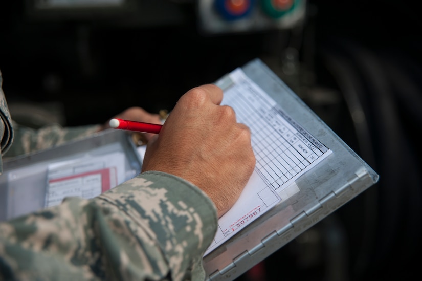 Airman 1st Class Christopher Castro, 628th Logistics Readiness Squadron Petroleum Oil and Lubricants fuels specialist, records receipt information after servicing a vehicle July 25, 2013, at Joint Base Charleston- Weapons Station, S.C. POL fuels supplies JB Charleston vehicles with fuel, including rail operations, cranes on Wharf Alpha to offload ships, port operations on the water, the 628th Security Forces Squadron and the U.S. Coast Guard. The 628th LRS has been providing this service since October 2010. A new service station is under construction at the Weapons Station and is scheduled to open later this year. (U.S. Air Force photo/Senior Airman Ashlee Galloway)