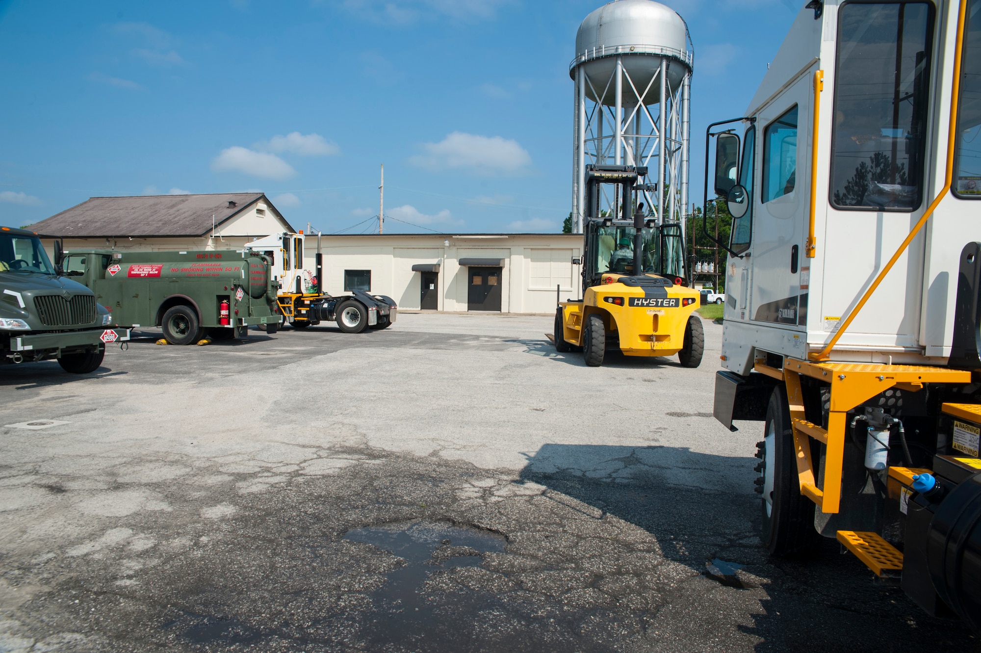 Customers line up to be serviced with DS-2 diesel fuel July 25, 2013, at Joint Base Charleston- Weapons Station, S.C. POL fuels supplies JB Charleston vehicles with fuel, including rail operations, cranes on Wharf Alpha to offload ships, port operations on the water, the 628th Security Forces Squadron and the U.S. Coast Guard. The 628th LRS has been providing this service since October 2010. A new service station is under construction at the Weapons Station and is scheduled to open later this year. (U.S. Air Force photo/Senior Airman Ashlee Galloway)