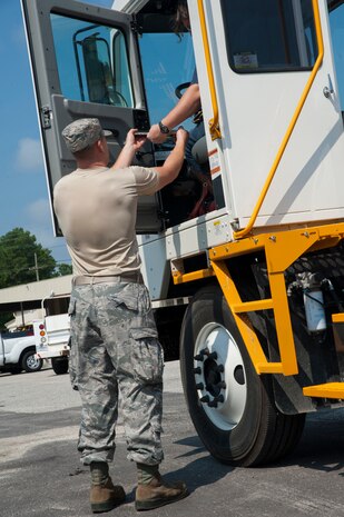 Senior Airman Mark Roth, 628th Logistics Readiness Squadron Petroleum Oil and Lubricants fuels specialist, gets a customer’s signature July 25, 2013, at Joint Base Charleston- Weapons Station, S.C. In one month, the 628th LRS POL fuels provided more than 1,600 gallons of gas to 80 vehicles on the Weapons Station. The 628th LRS has been providing this service since October 2010. A new service station is under construction at the Weapons Station and is scheduled to open later this year.  (U.S. Air Force photo/Senior Airman Ashlee Galloway)

