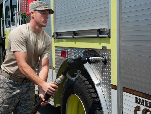 Senior Airman Mark Roth, 628th Logistics Readiness Squadron Petroleum Oil and Lubricants fuels specialist, refuels a 628th Civil Engineer Squadron fire truck July 25, 2013, at Joint Base Charleston- Weapons Station, S.C. POL fuels supplies JB Charleston vehicles with fuel, including rail operations, cranes on Wharf Alpha to offload ships, port operations on the water, the 628th Security Forces Squadron and the U.S. Coast Guard. The 628th LRS has been providing this service since October 2010. A new service station is under construction at the Weapons Station and is scheduled to open later this year. (U.S. Air Force photo/Senior Airman Ashlee Galloway)