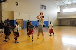 Gage Belyeu shoots during a round of basketball at the Rambler Fitness Center at Joint Base San Antonio-Randolph July 29.  (U.S. Air Force photo by Rich McFadden/released) 