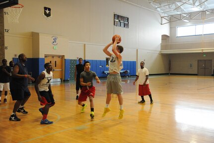 Gage Belyeu shoots during a round of basketball at the Rambler Fitness Center at Joint Base San Antonio-Randolph July 29.  (U.S. Air Force photo by Rich McFadden/released) 