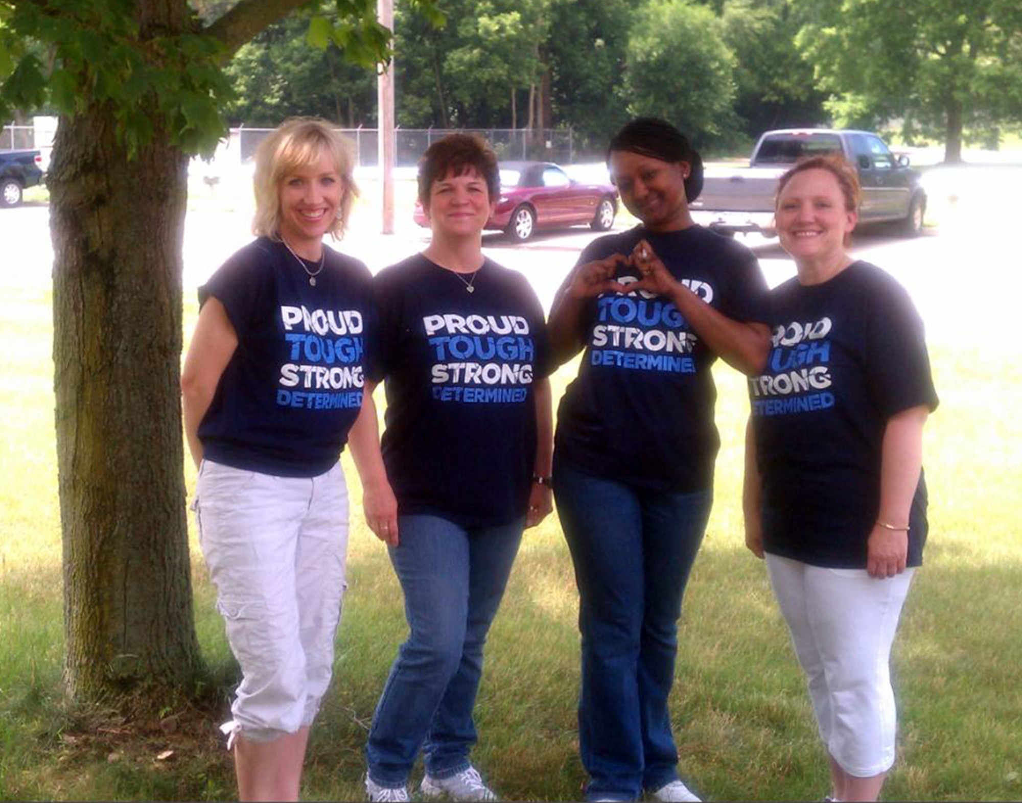 WRIGHT-PATTERSON AIR FORCE BASE, Ohio – The 445th Airlift Wing supported Post Traumatic Stress Disorder Awareness Day June 27. To show their support, t-shirts printed with the words, “PROUD, TOUGH, STRONG, DETERMINED” were worn by wing members throughout the day. Leading the effort was the North Region Psychological Health Advocacy Program staff (from left to right); Pamela Boyd, Outreach Specialist, Melanie McMann. Outreach Specialist, Samarra Appling, Administrative Specialist, Jennifer Wedel Case Facilitator. (Courtesy photo)
