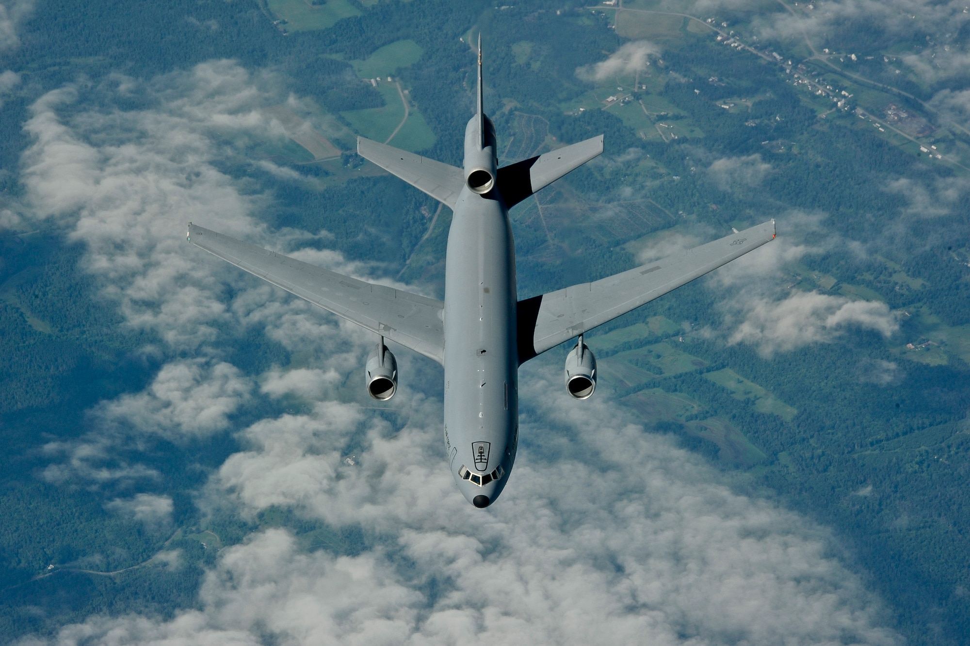 A KC-10 Extender flies into position to practice receiving fuel from another KC-10 during a training sortie July 29, 2013. Both the pilot and copilot make several attempts at air refueling before switching positions with the other tanker to maximize training efficiency. (U.S. Air Force photo by Airman 1st Class Ryan Throneberry/Released)
