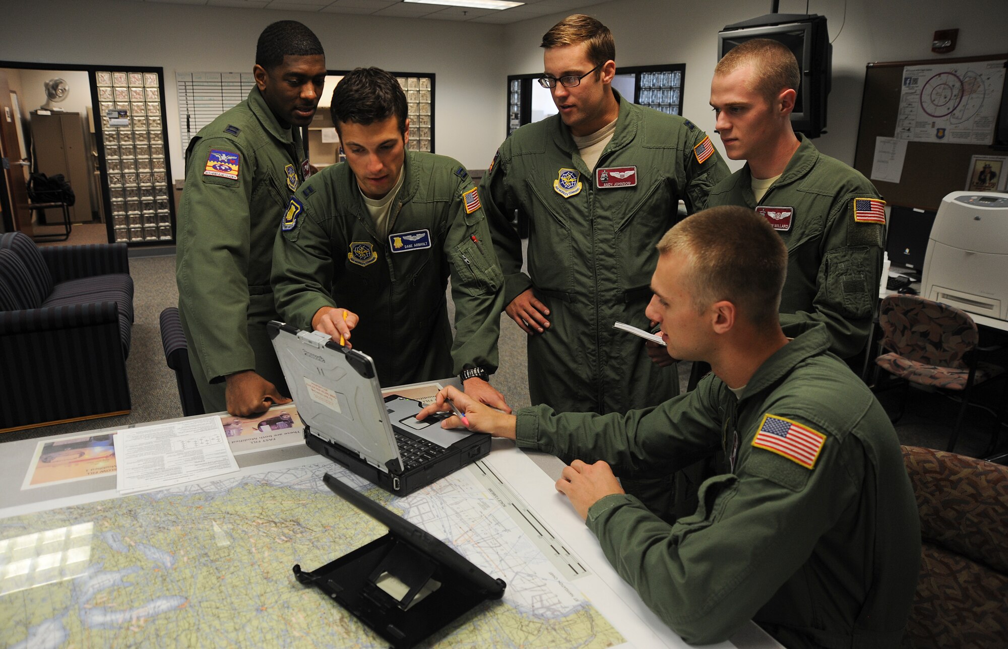 MCCONNELL AIR FORCE BASE, Kansas -- The Department of Energy has chosen the 22nd Operations Group Fuel Efficiency Office here as a 2013 Federal Energy Management Program Award Winner. The FEO designed and implemented measures to reduce and eliminate inefficiency in fuel management of the KC-135. Pictured left to right: Capt Dom Willis, Capt Dane Arnholt, Capt Andy
Johnson, SrA Andrew Willard, SrA Sam Johnson
(U.S. Air Force photo)