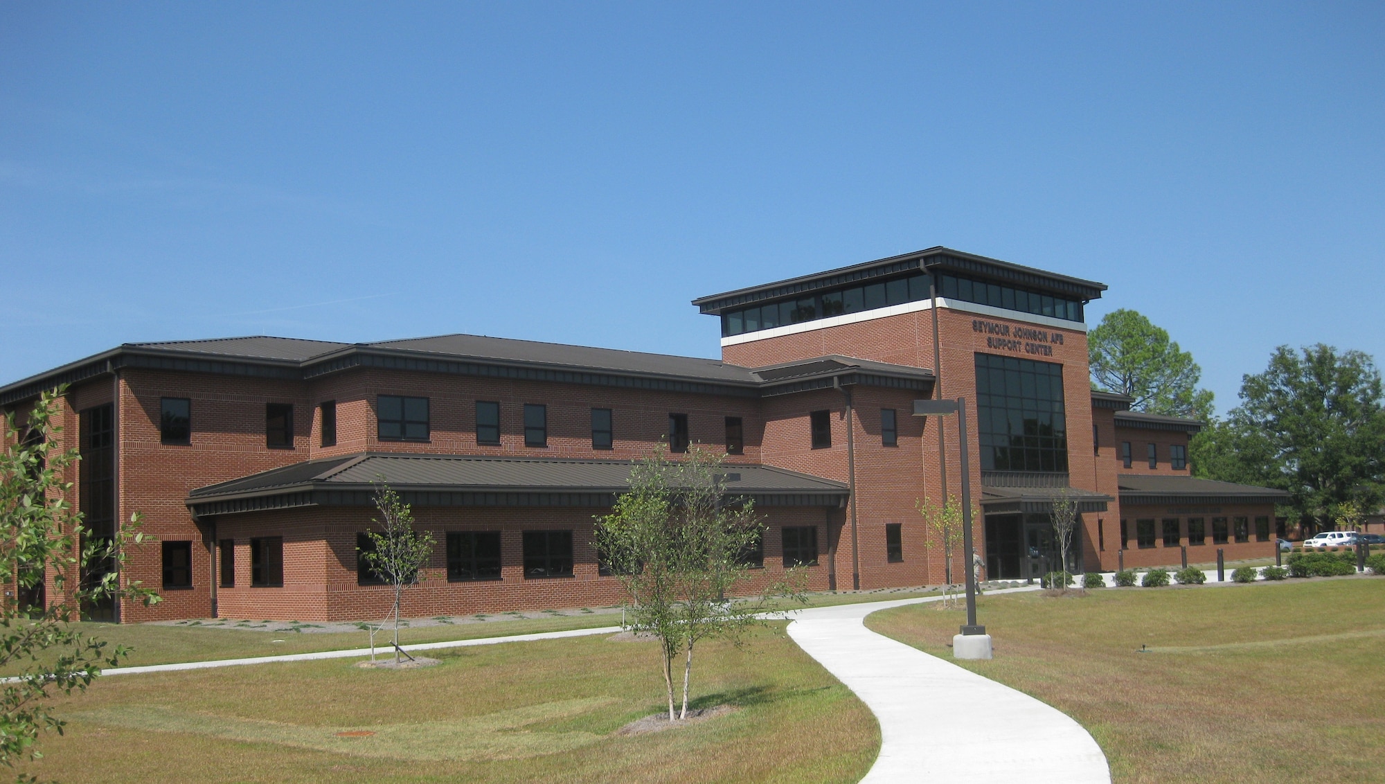 SEYMOUR JOHNSON AIR FORCE BASE, N.C. -- Engineers here designed and executed a project to build this support center, which earned a Gold Leadership in
Energy and Environmental Design award. The new building consolidates five
organizations into a single facility reducing energy consumption by 60 percent
and energy costs by 50 percent. The Department of Energy will award the project
team including: Environmental Engineer Brian Joyner, Base Energy Manager
Matthew Latham, Resource Efficiency Manager Elias Schtakleff, Mechanical
Engineer Jeffrey Howard and Energy Management Control System Operator
Chris Wheeler; a 2013 Federal Energy Management Program award in November. (U.S. Air Force photo)