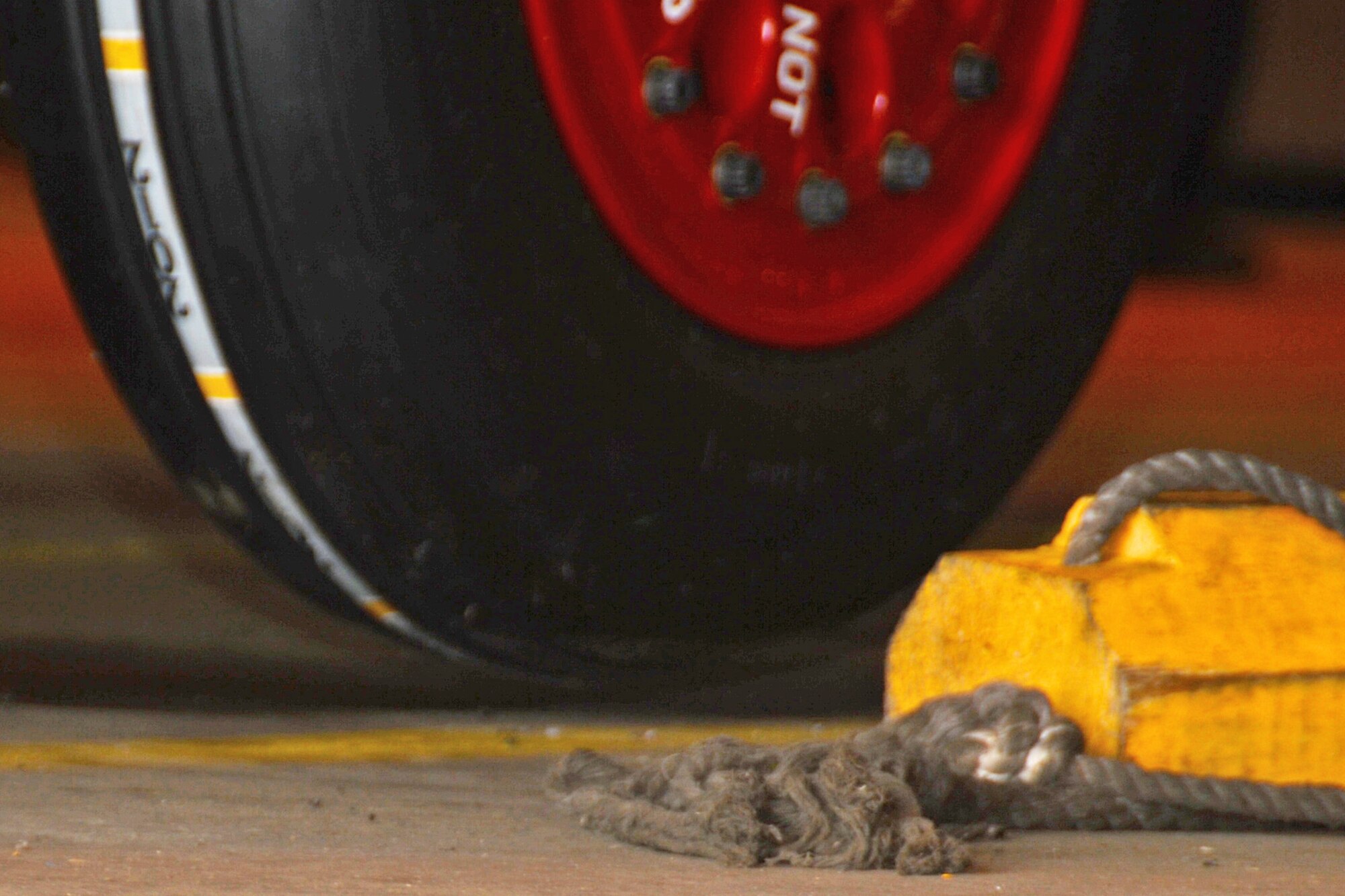 An F-15C Eagle wheel separates from the ground, displaying that a lift has been successfully completed during crash recovery training at Royal Air Force Lakenheath, England, July 27, 2013. Airmen from the 48th Equipment Maintenance Squadron lifted an F-15C Eagle with high-capacity air bags as part of their annual training requirement to prepare for assisting with potential aircraft recovery operations. (U.S. Air Force photo by Airman 1st Class Trevor T. McBride/Released) 
