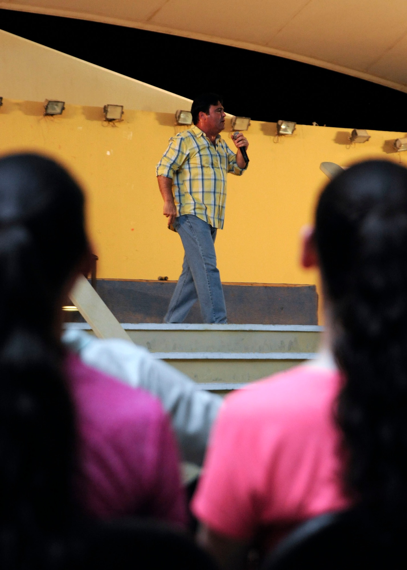 Comedian Sam Fedele tells jokes during Don Barnhart’s All-Star Comedy tour performance presented by Armed Forces Entertainment at the 379th Air Expeditionary Wing in Southwest Asia, July 28, 2013. The former marine expressed his gratitude toward all deployed service members in attendance. (U.S. Air Force photo/Senior Airman Bahja J. Jones) 


