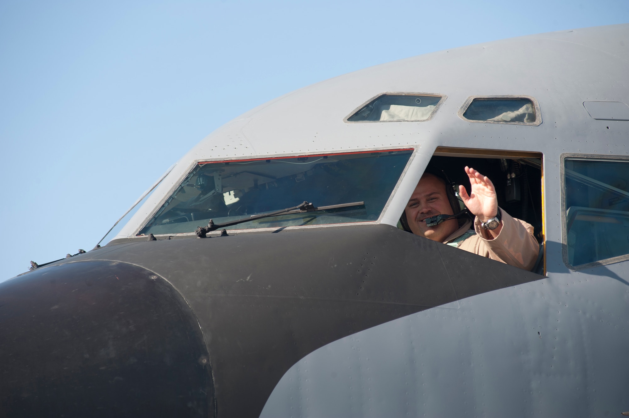 Capt. Brent Helinski, 22nd Expeditionary Air Refueling Squadron, waves after landing at Transit Center at Manas, Kyrgyzstan, July 25, 2013. Helinksi joined the Air Force to become a pilot and has served 19 years. (U.S. Air Force photo/Staff Sgt. Robert Barnett)