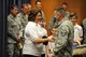 Miriam Hamilton, widow of U.S. Air Force Capt. Nathan Nylander, thanks U.S. Air Force Tech. Sgt. Sean Blaisdell, July 19 at the Air Force Weather Agency at Offutt Air Force Base, Neb. Blaisdell was one of the more than 30 men and women from AFWA who participated in a vigil honoring their fallen Airman in April. (Photo by Josh Plueger)